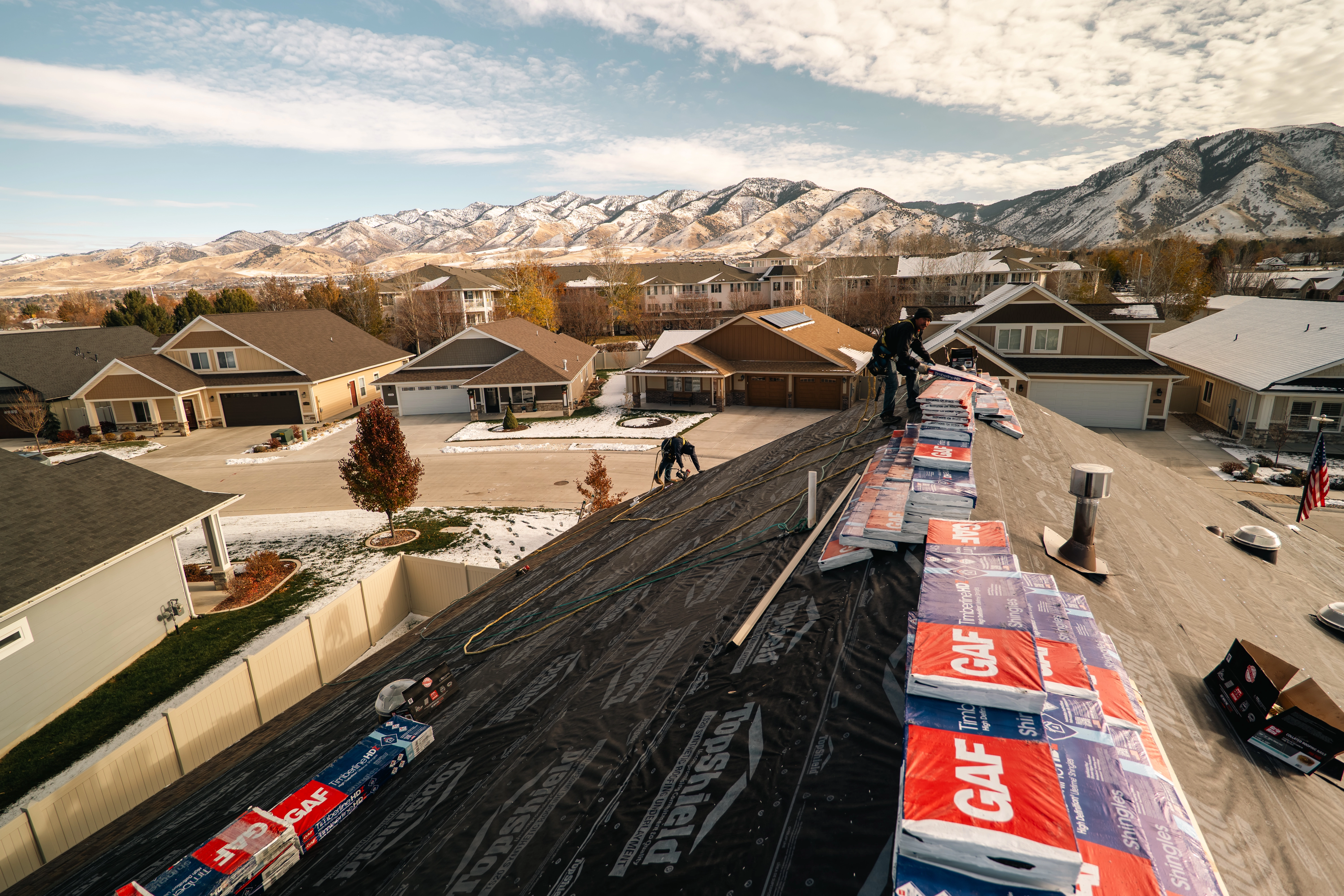 Homer Roofing crew replacing a roof in Northern Utah