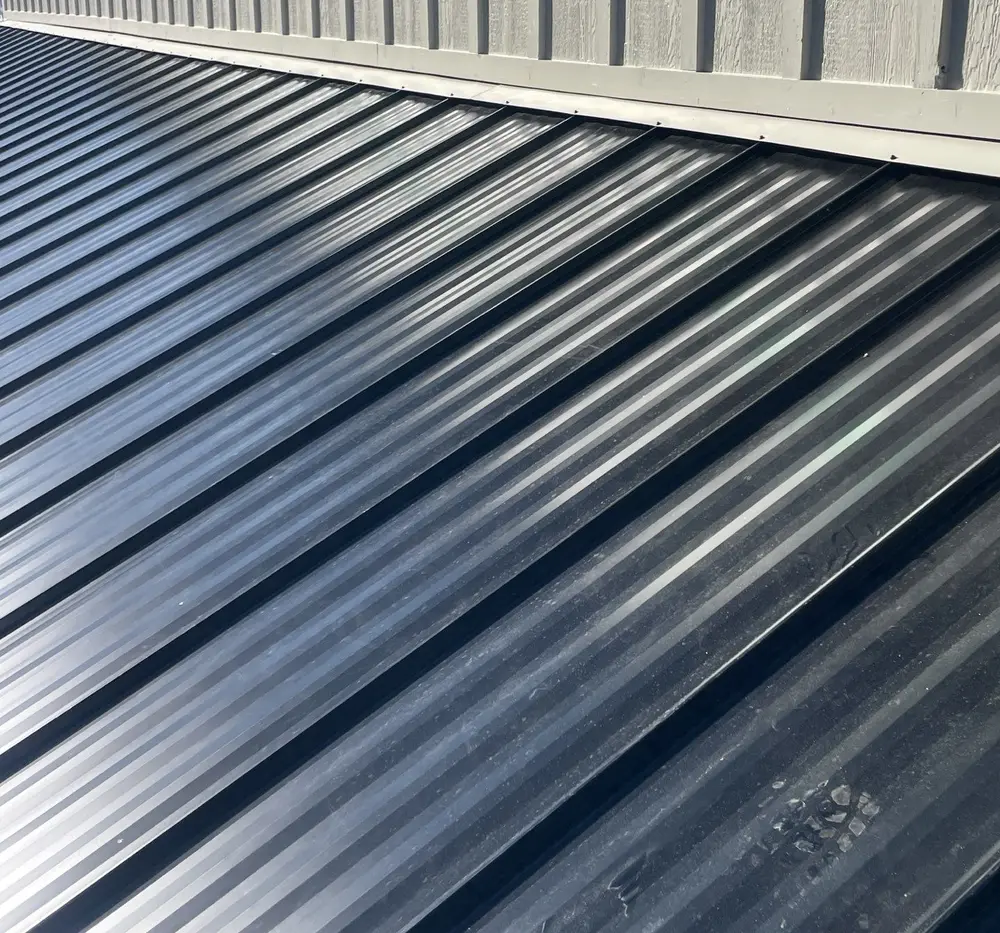 Black metal roof installed by Homer Roofing in Garden City, Utah
