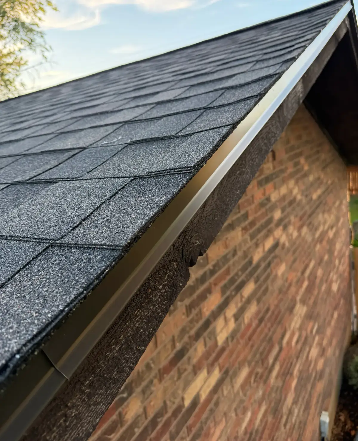 Close-up of new black architectural shingles and a clean rake edge on a Roy, Utah roof by Homer Roofing