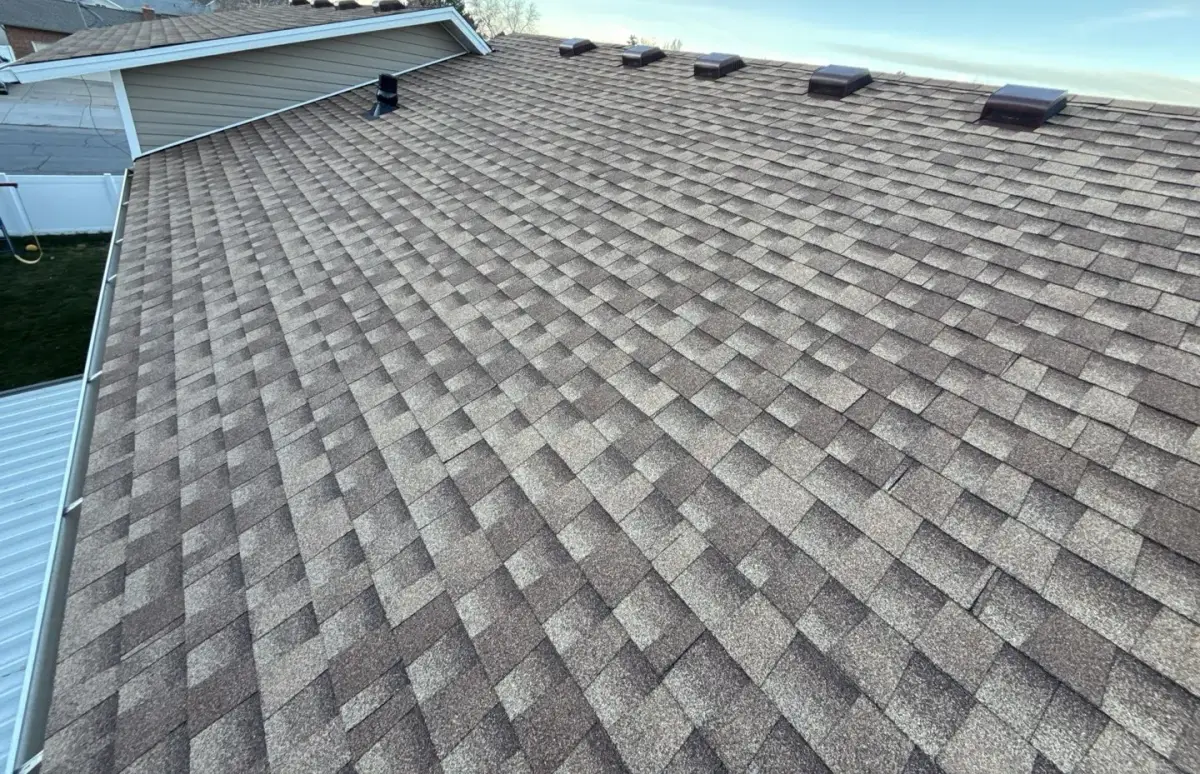 New asphalt shingle roof slope with box vents on a Roy, Utah home by Homer Roofing
