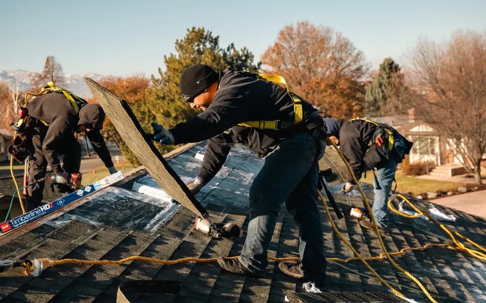 Homer Roofing crew installing shingles over ice and water shield