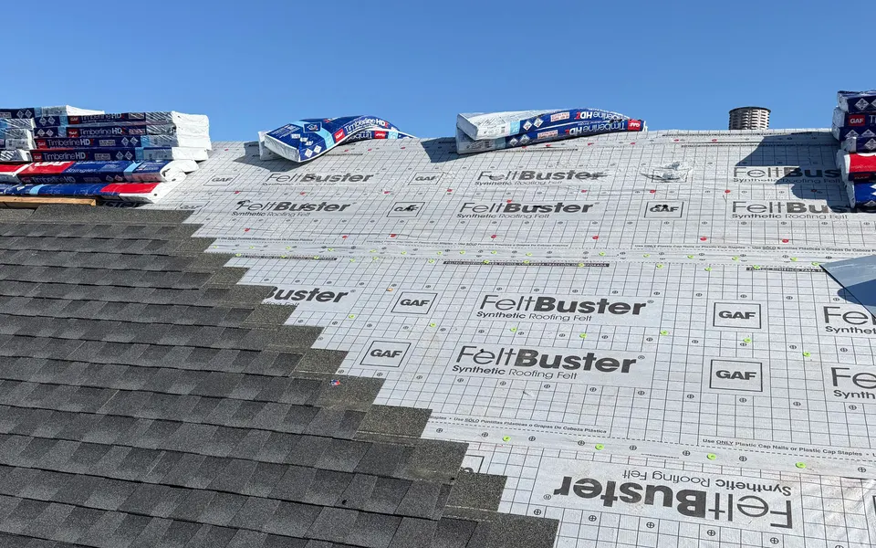 GAF FeltBuster synthetic underlayment on a roof deck with shingles going on over it