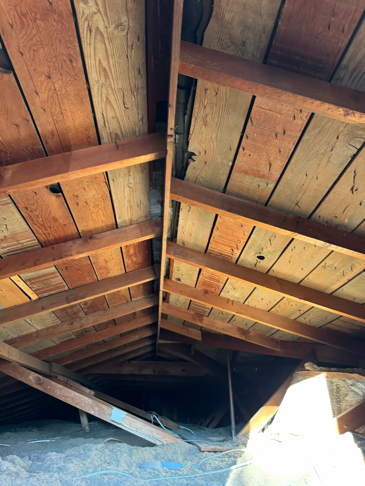 Close up of spaced plank decking gaps on a Utah home roof